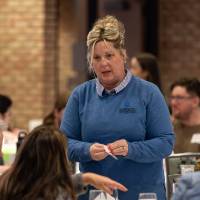 person standing and talking photo 3